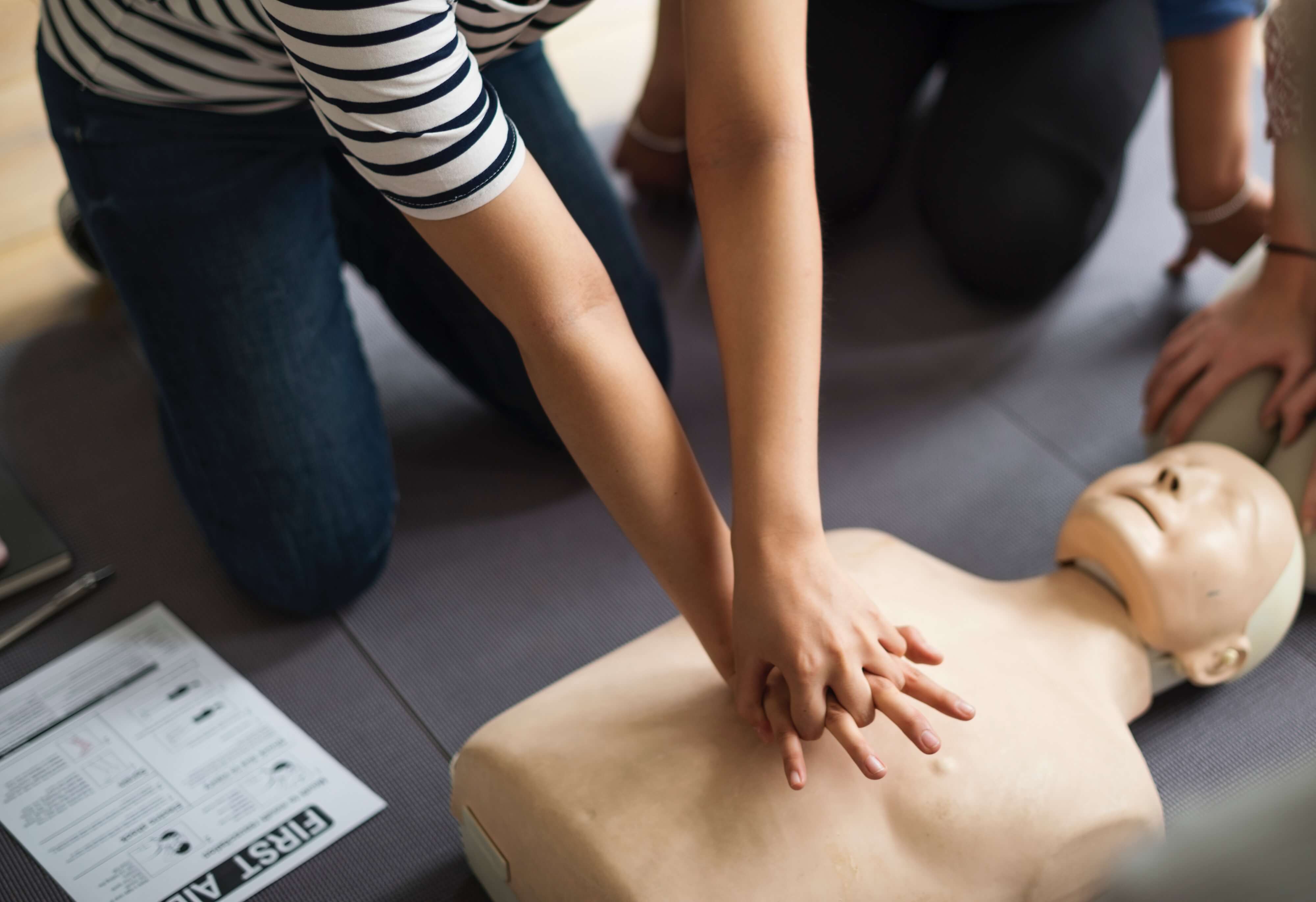 Image of people learning CPR