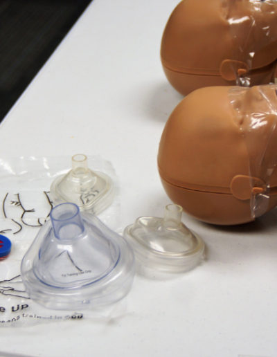 Image of infant manikins with CPR masks in several sizes.
