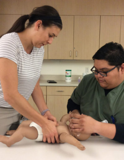 Photo of students working together on infant CPR