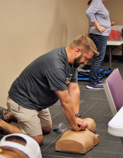 Photo of a student practicing chest compressions