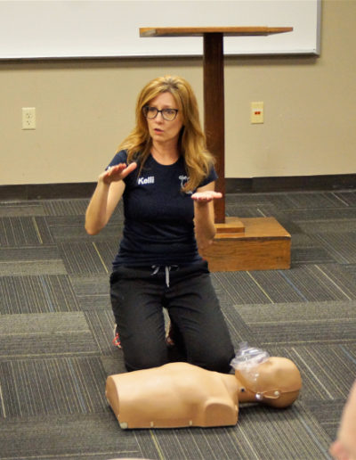 Photo of Instructor explaining CPR to students
